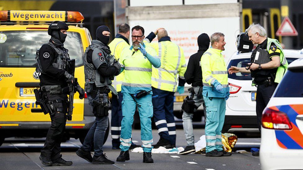 Police forces and emergency services stand at the scene of a terror attack on a tram Utrecht in March 2019