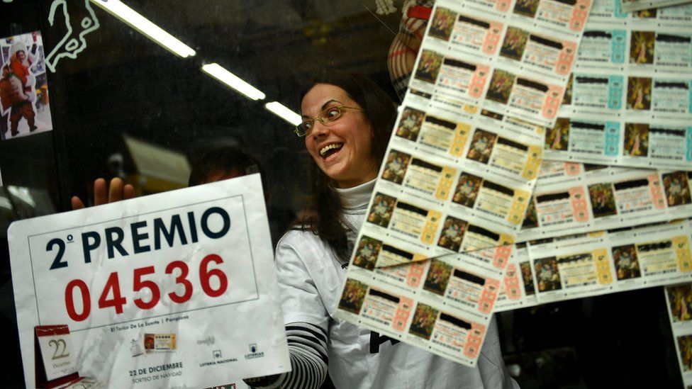 Monica celebrates in her lottery office after selling the second Christmas lottery prize ""El Gordo"" with the number 04536, in Pamplona, northern Spain