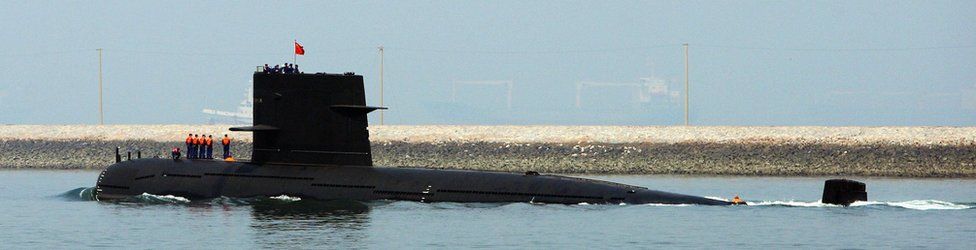A Chinese navy submarine leaves Qingdao Port on 22 April 2009.