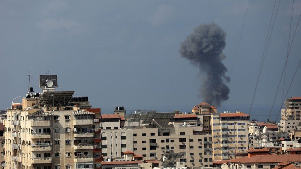Smoke billows from an Israeli air strike in Gaza City.