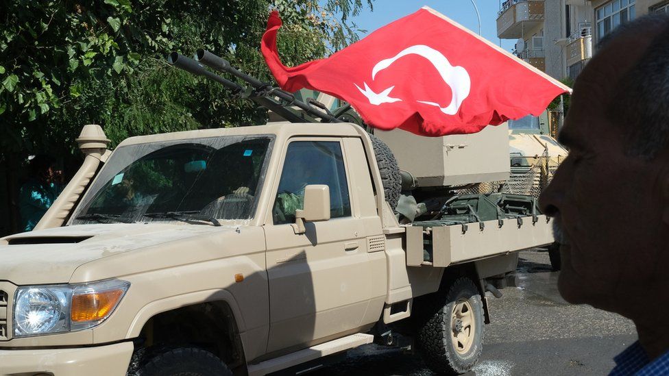Turkish military vehicle and flag