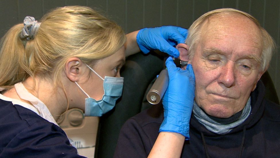 Cavan Granleese having his ear inspected for wax