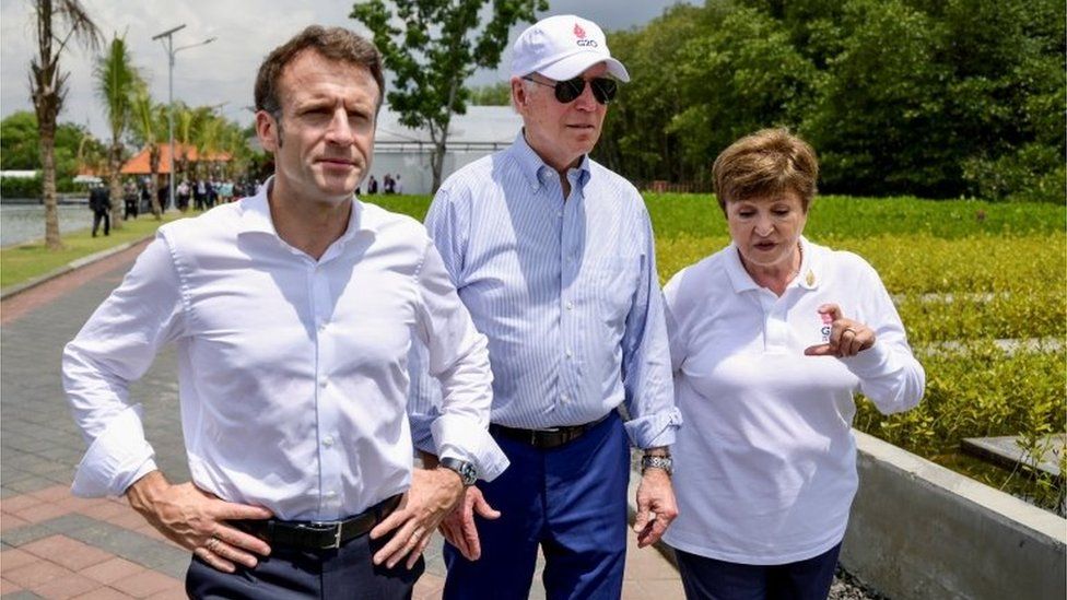 US President Joe Biden (centre) walks with France"s President Emmanuel Macron and International Monetary Fund Managing Director Kristalina Georgieva during their visit to a mangrove conservation forest on the sidelines of the G20 summit meeting, in Bali, Indonesia November 16, 2022.