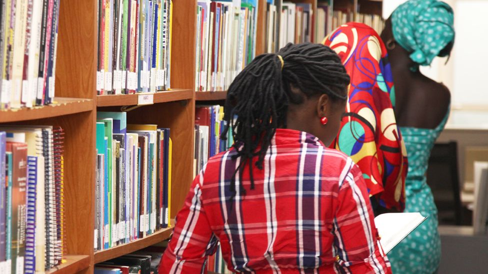 Three teenagers who escaped a Boko Haram kidnapping in Chibok seen in a library at the American University of Nigeria, in Yola, Adamawa state, Nigeria - May 2015