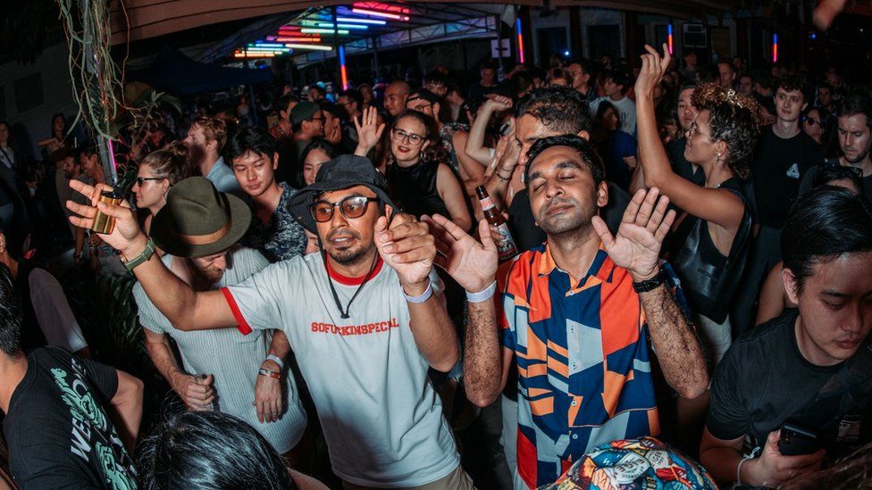 A crowd of dancers at a rave in Singapore on 5/11