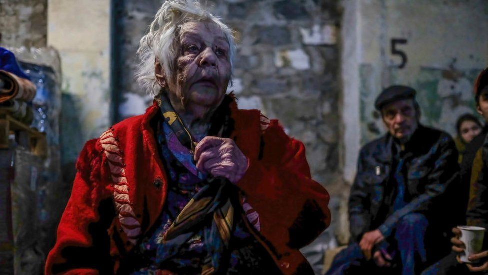 An injured woman seen inside the center for distribution of humanitarian aid in Severodonetsk