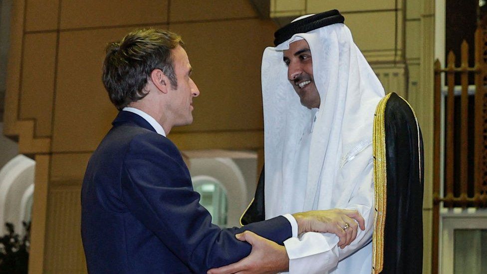 French President Emmanuel Macron meets Qatar's Emir Sheikh Tamim bin Hamad Al-Thani in Doha on 3 December