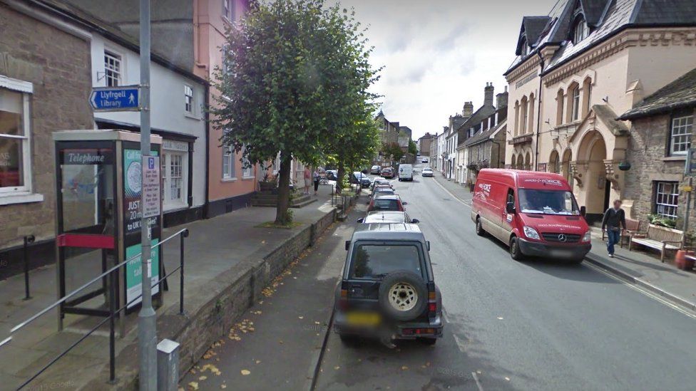 Hay on Wye street and library sign