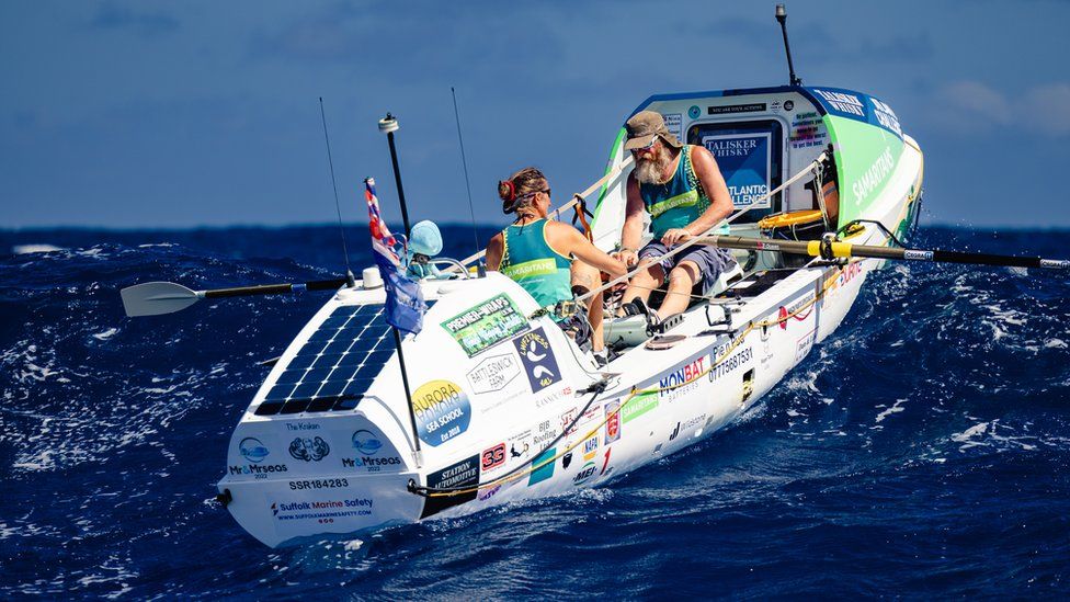 Nina and Simon Crouchman riding a wave in their rowing boat as they attempt to row Atlantic