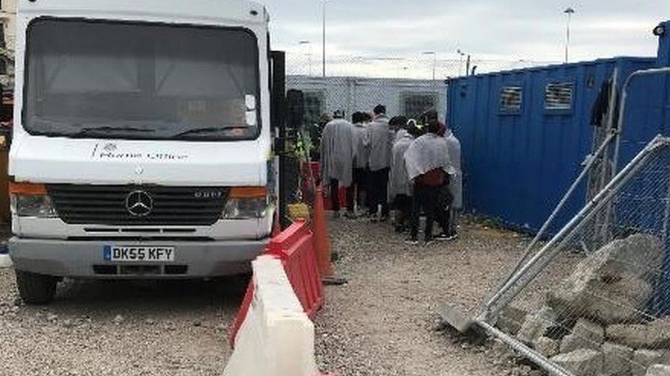 Migrants being received at the Tug Haven site