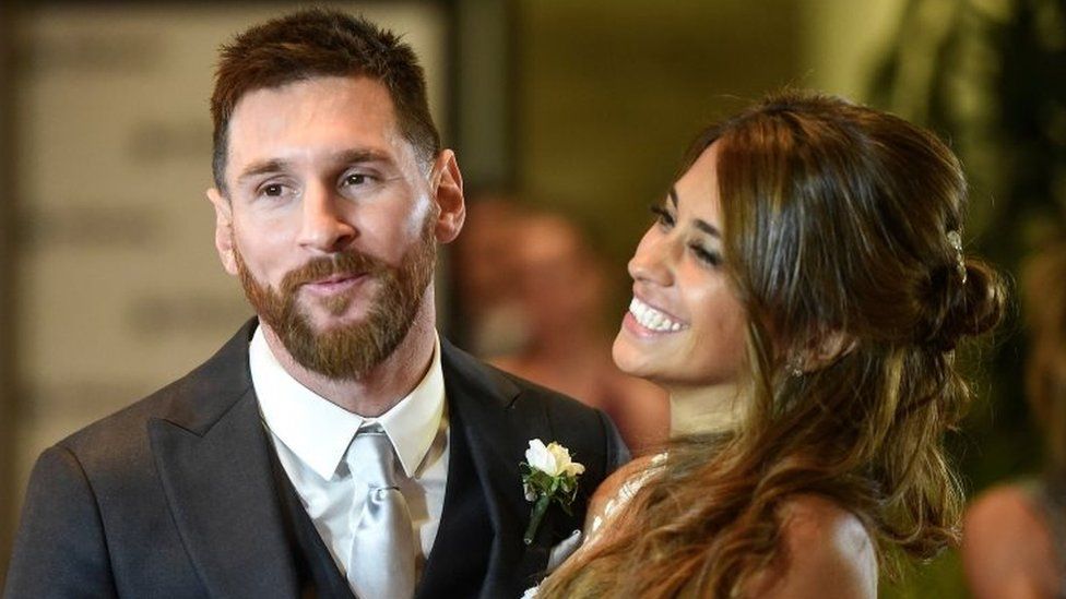 Argentine football star Lionel Messi and bride Antonella Roccuzzo pose for photographers just after their wedding at the City Centre Complex in Rosario, Santa Fe province, Argentina on 30 June 2017.