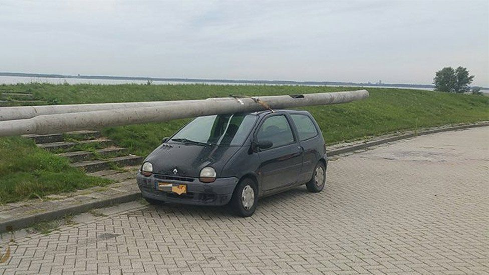 Car with lampposts