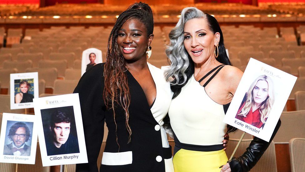 Clara Amfo (left) and Michelle Visage are seen at a "heads on sticks" photocall at the Royal Festival Hall in London ahead of the BAFTA Television Awards on Sunday