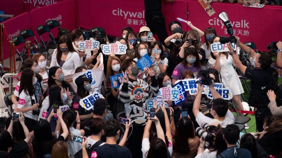Edan Lui of boy band Mirror is surrounded by fans