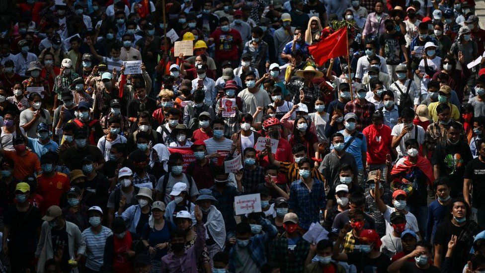 Protesters march during a demonstration against the military coup in Yangon