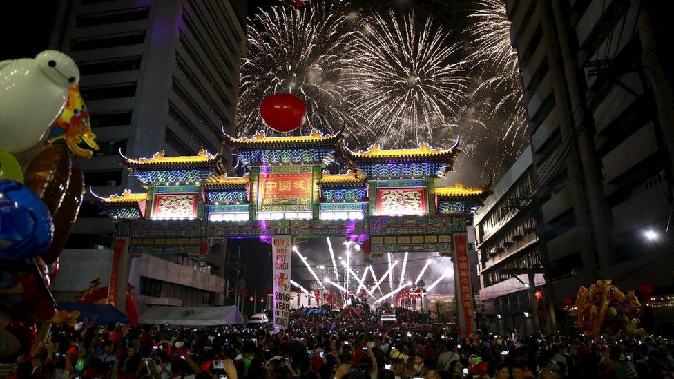 Spectators watch as colourful fireworks light up the night sky welcoming the Chinese New Year at the Chinatown in Manila February 7, 2016