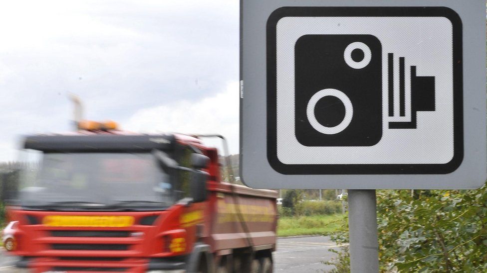 Speed camera sign and lorry
