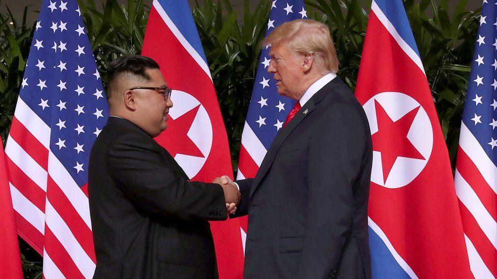 US President Donald Trump and North Korean leader Kim Jong-un shake hands during the Singapore Summit in 2018