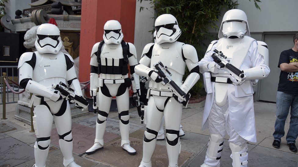Stormtroopers pose at the opening of The Rise of Skywalker on 19 December in California
