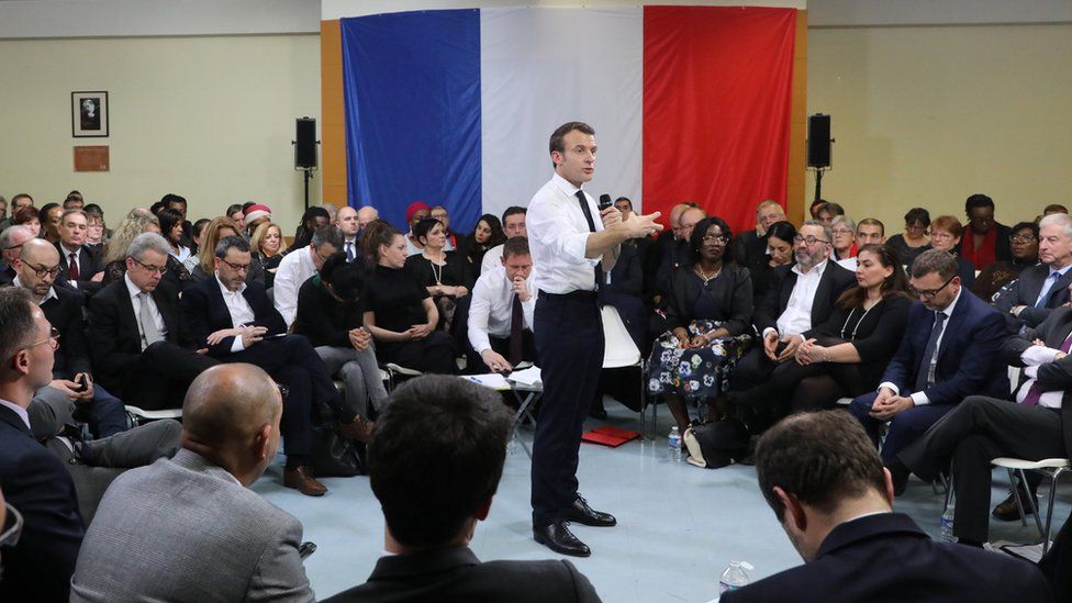 Emmanuel Macron attends a meeting as part of the "great national debate" in Evry-Courcouronnes, France February 4, 2019