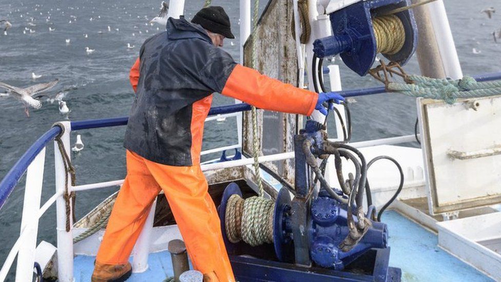 Fisherman on trawler