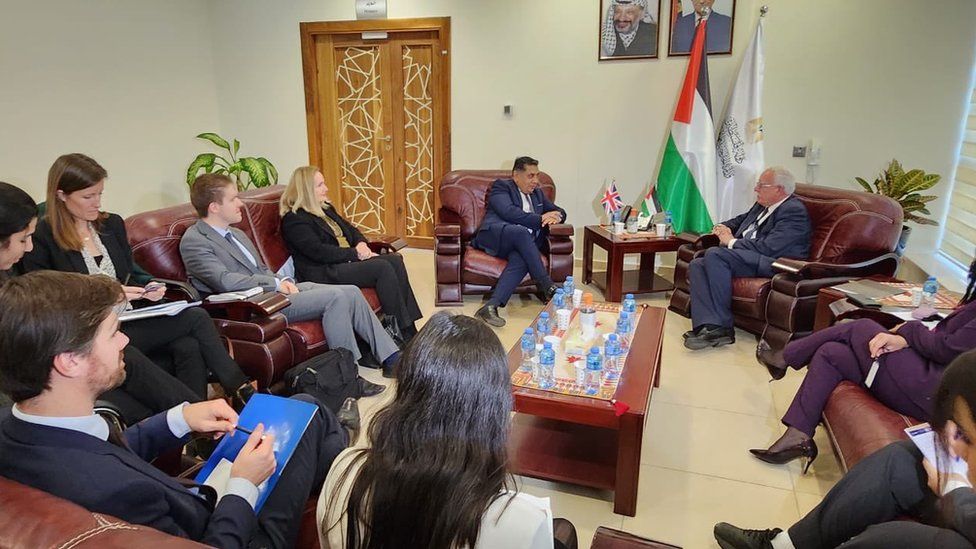British Foreign Office Minister Lord Ahmad (C) attends talks with Palestinian Foreign Minister Riad Malki (R) in Ramallah