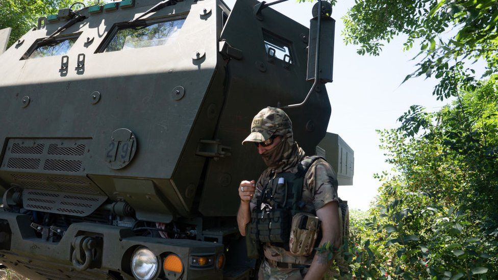 Ukrainian soldier and Himars