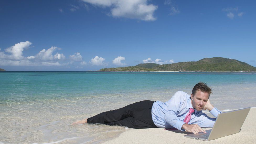 Man in suit on beach