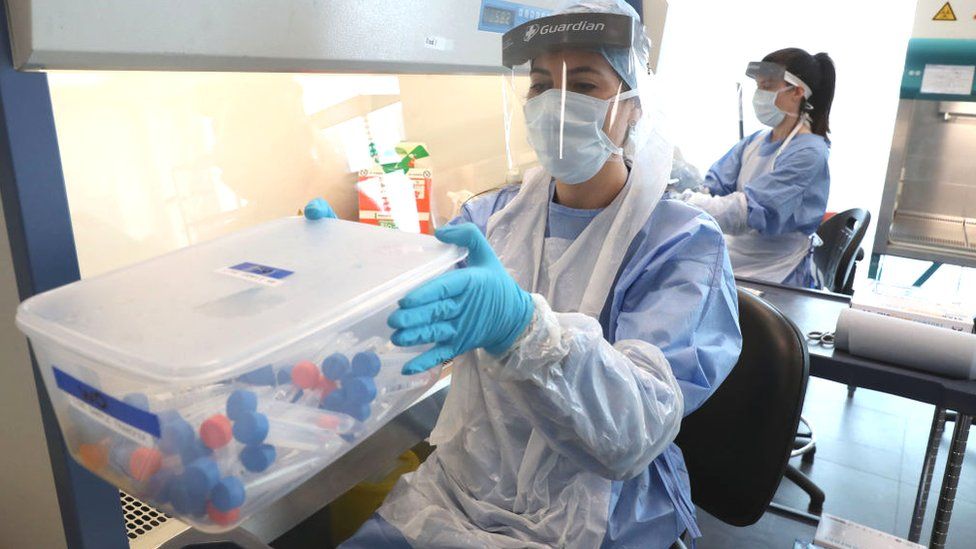 Live samples in test tubes are held in a container during the opening of the new Covid-19 testing lab at Queen Elizabeth University Hospital