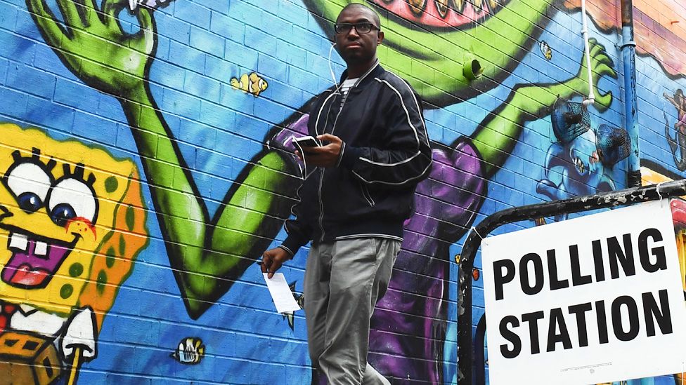 Young man at a polling station