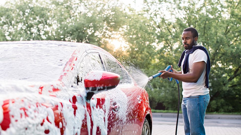 Man washing a car