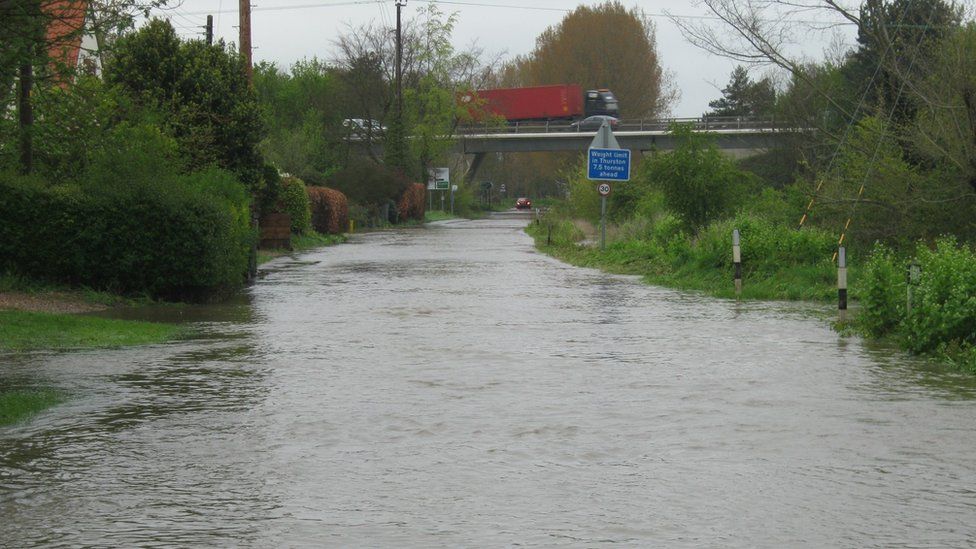 Flooded road between Beyton and Thurston in Suffolk