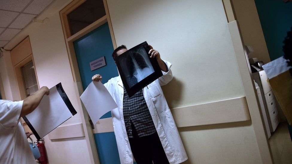 Doctor looks at an x-ray in a Greek hospital