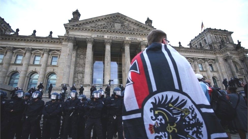 A right-wing protester in front of Germany's Reichstag, 29 August 2020