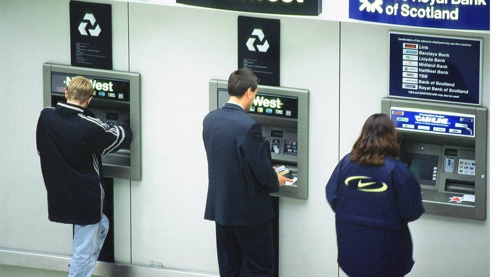 People using ATMs