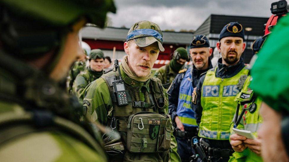 Soldiers with police officers during a defence exercise