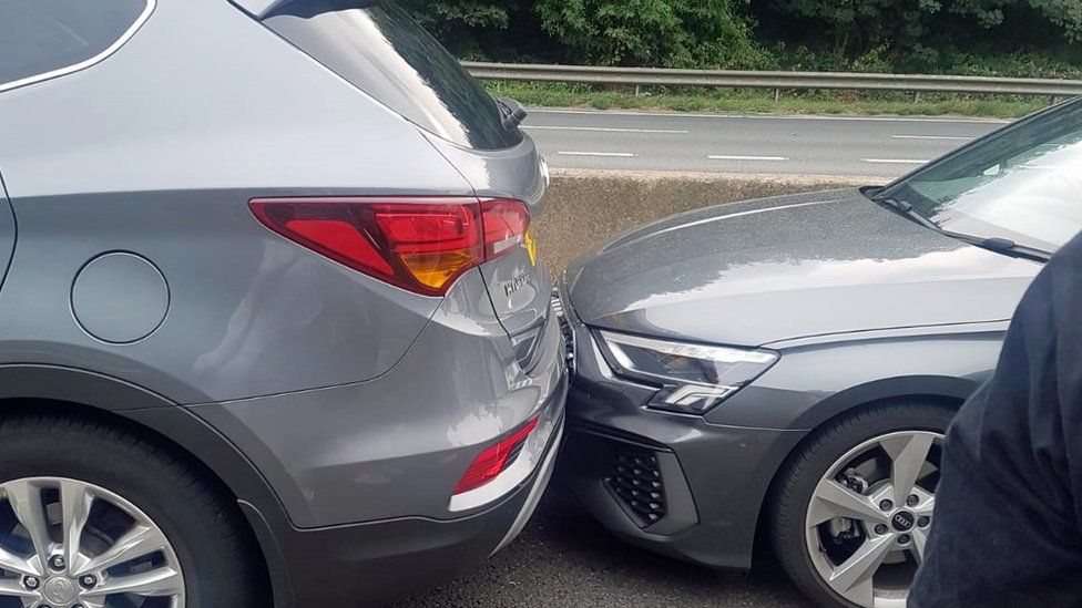 Two cars stopped bumper to bumper