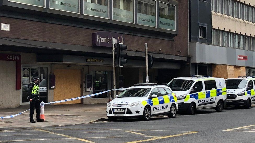 Man treated for stab wounds outside city hotel - BBC News