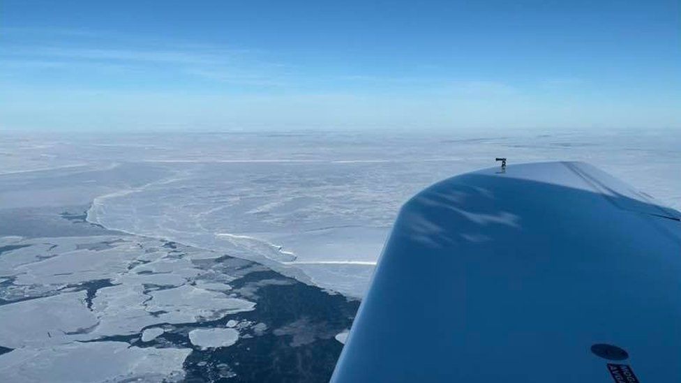 View from the aircraft of an icy landscape between Nome and Magadan