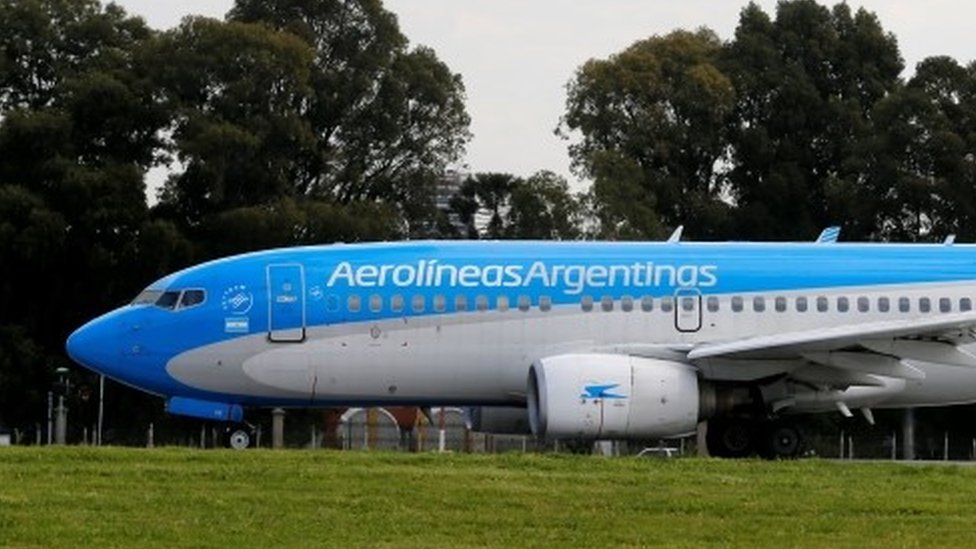 A Boeing 737-700 aircraft belonging to state-run Aerolineas Argentinas sits on the tarmac of the Buenos Aires" domestic airport