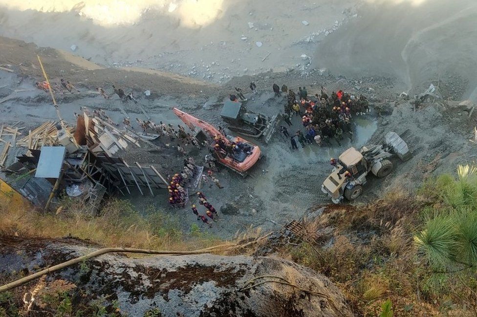 Rescue team members work near a tunnel after a part of a glacier broke away and caused flood in Tapovan, northern state of Uttarakhand, India, February 8, 2021