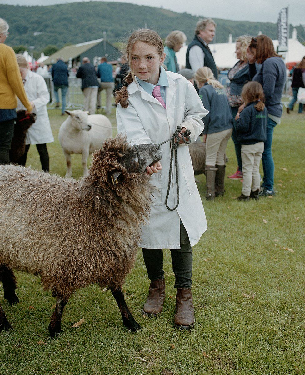 Young girl with ewe lamb