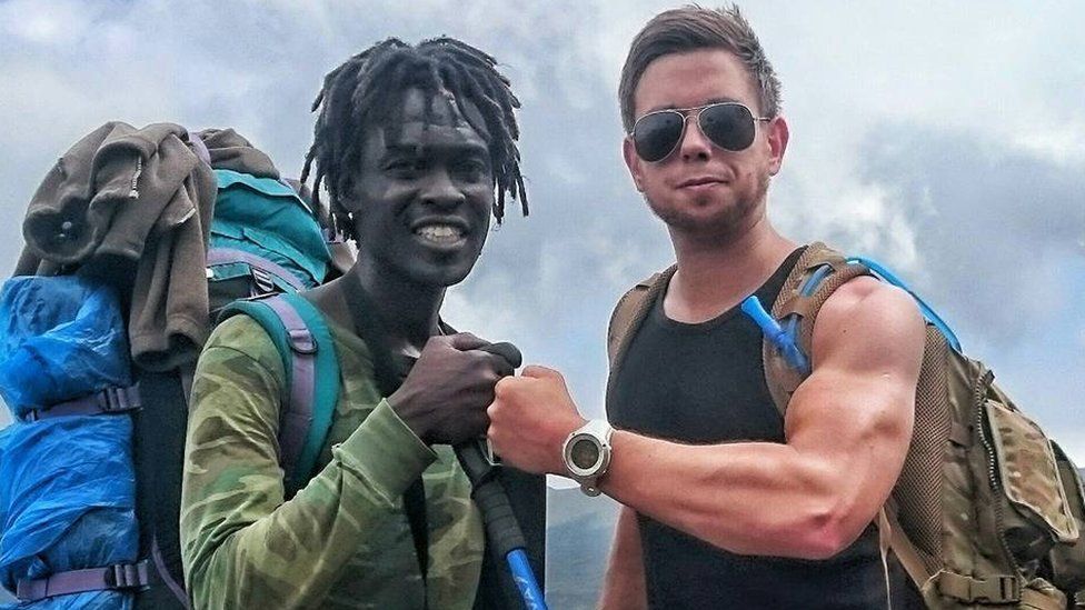 Mark Lloyd and a guide ahead of climbing Kilimanjaro