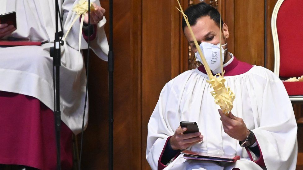 Vatican cleric in mask on Palm Sunday, 5 Apr 20