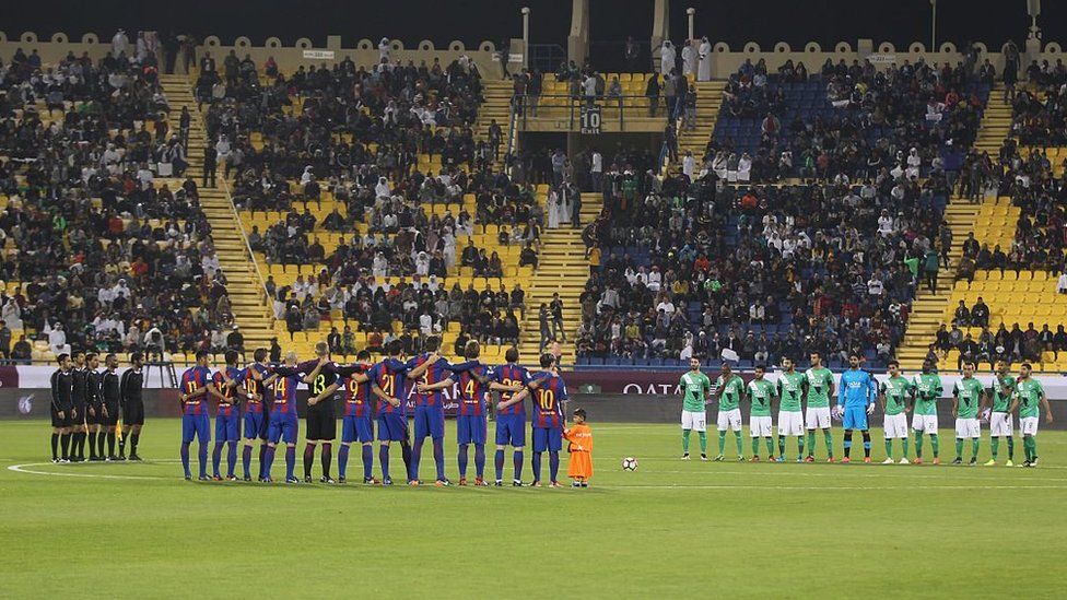 Teams observe one minute of silence during the Qatar Airways Cup match between FC Barcelona and Al-Ahli Saudi FC on 13 December 2016 in Doha, Qatar