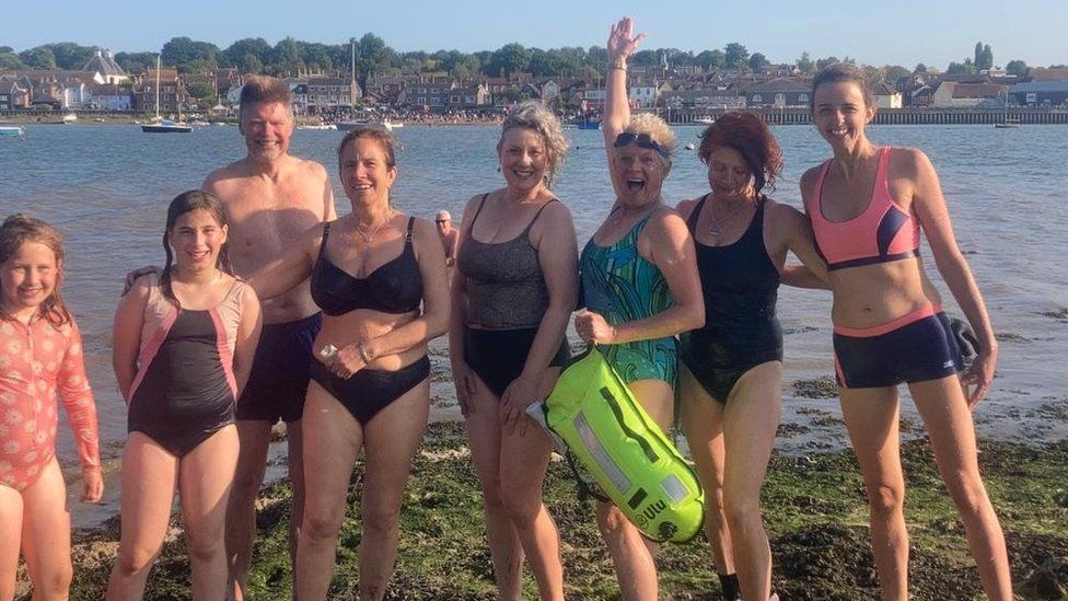 swimmers in Suffolk having swam over from Essex