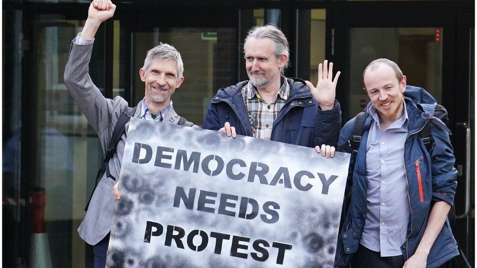 Dr Larch Maxey, Extinction Rebellion's co-founder Roger Hallam and Michael Lynch-White outside Isleworth Crown Court in London, after they received a suspended sentence, for allegedly trying to shut down Heathrow Airport with small toy drones in September 2019.