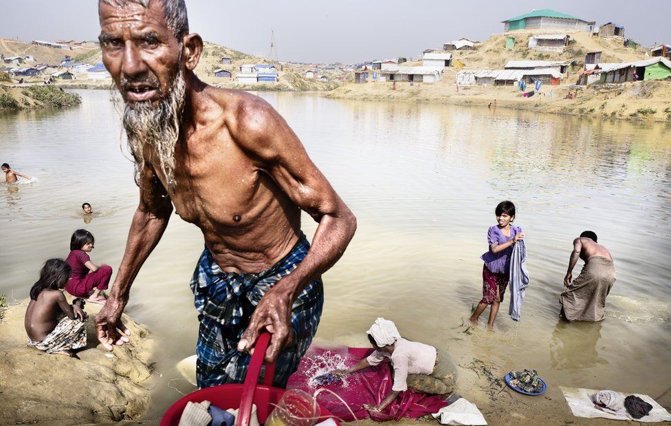 A man comes out of bathing in a river