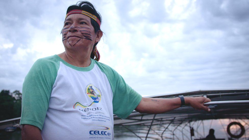 Navigator and community elder, Hilario Saant stands on the solar canoe
