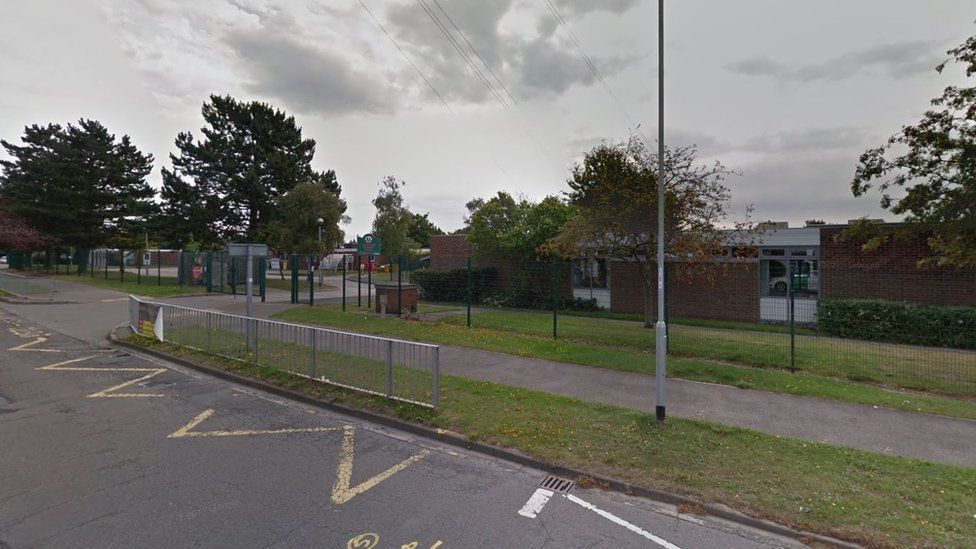 Woman tried to steal baby from car outside Northampton school - BBC News